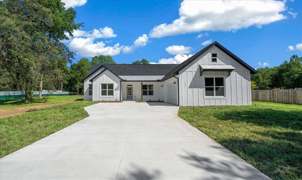 Front exterior of a new home in , Ocala, FL, highlighting curb appeal (Image 2). Front exterior of a new home in , Ocala, FL, highlighting curb appeal (Image 2).