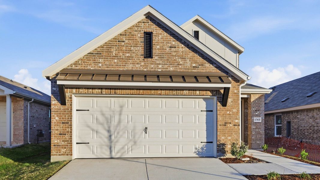 Front exterior of a new home in Walden Pond, Forney, TX, highlighting curb appeal (Image 2). Front exterior of a new home in Walden Pond, Forney, TX, highlighting curb appeal (Image 2).