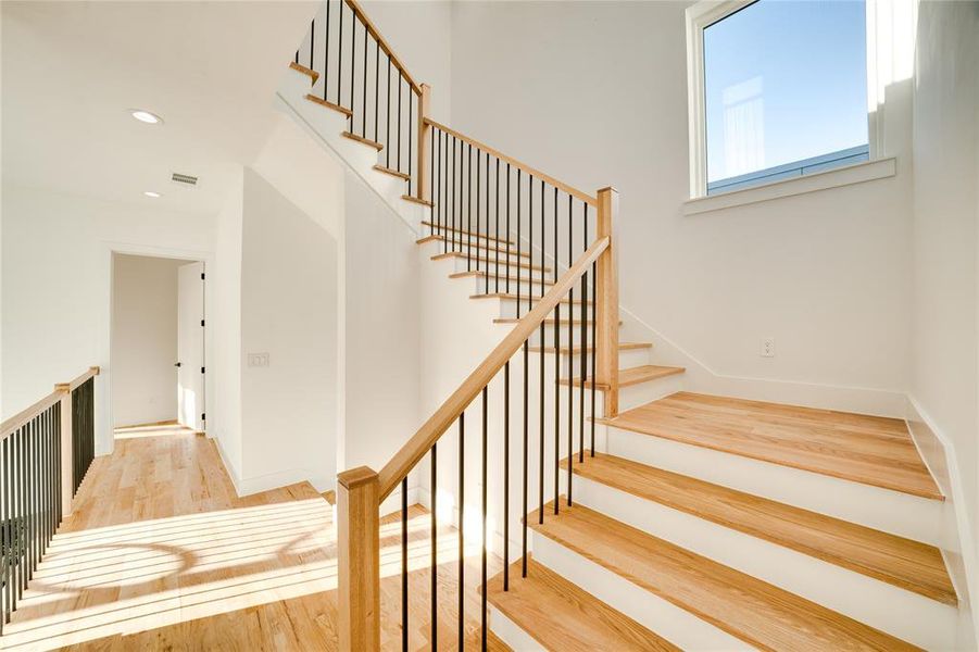 Stairs featuring wood-type flooring