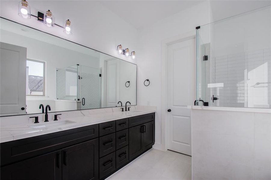 Primary ensuite. Photos of similar completed home by same builder. Selections may differ.