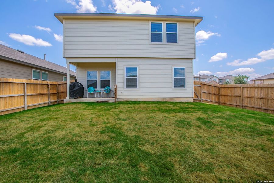 Exterior details and patio area of a home in The Links at River Bend, Floresville (Image 4).