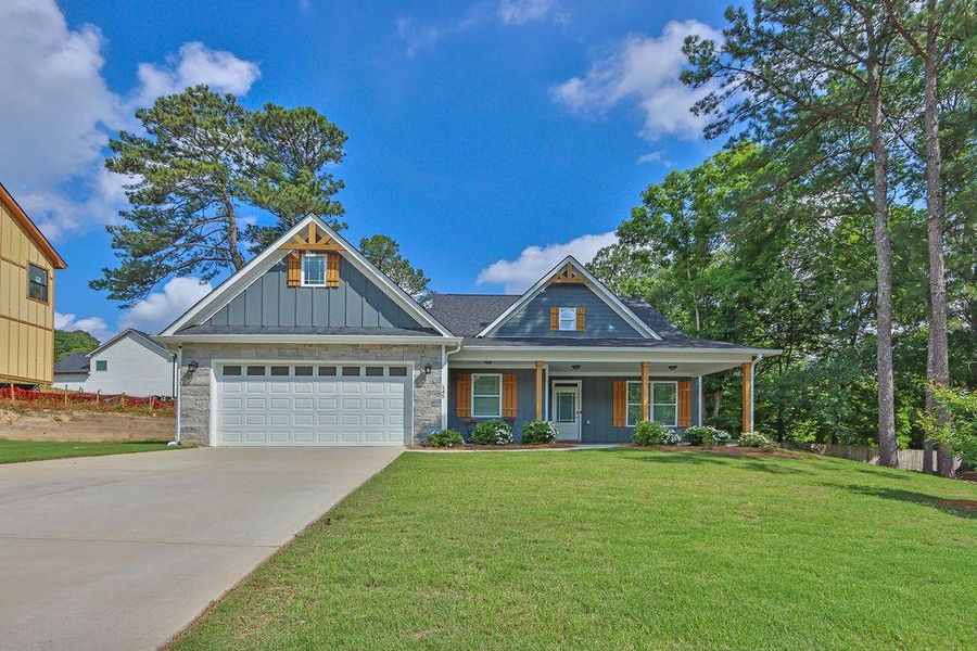 Front exterior of a new home in , Lawrenceville, GA, highlighting curb appeal (Image 1).