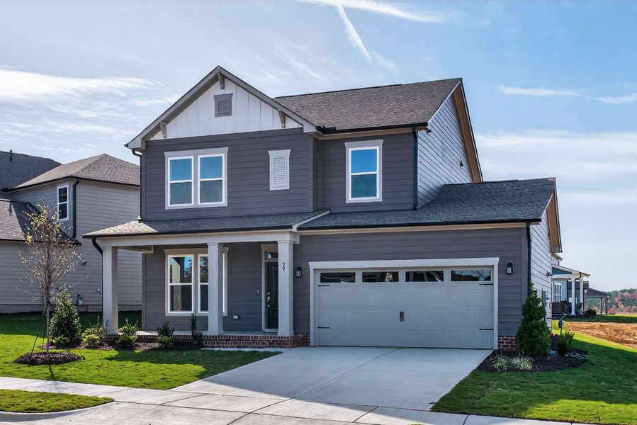 Front exterior of a new home in Serenity - The Village Collection, Fuquay Varina, NC, highlighting curb appeal (Image 22).