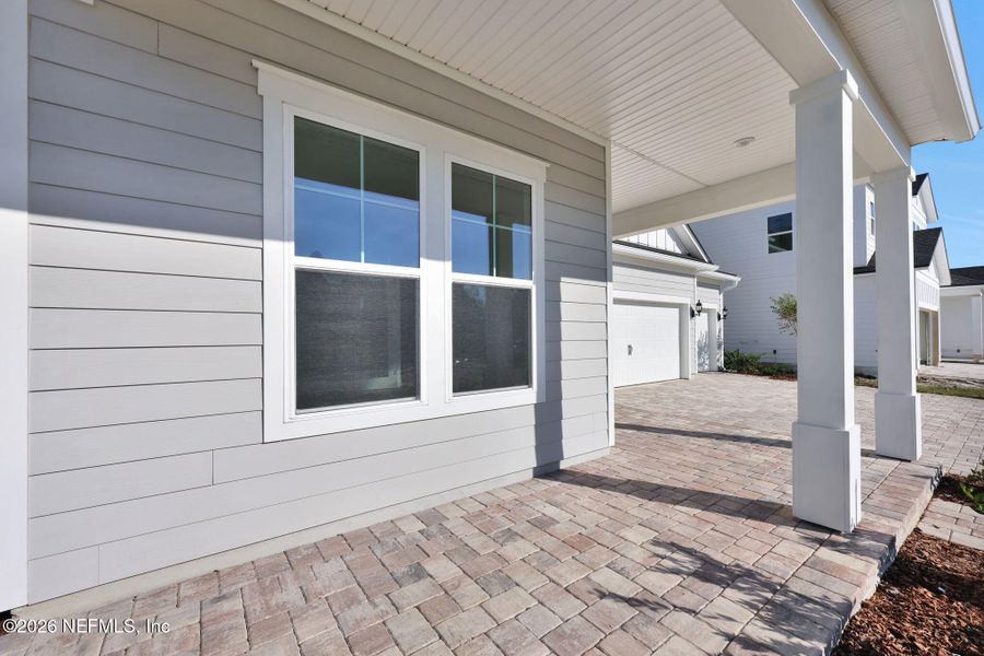Exterior details and patio area of a home in The Landings at Saint Johns, St. Johns (Image 3).
