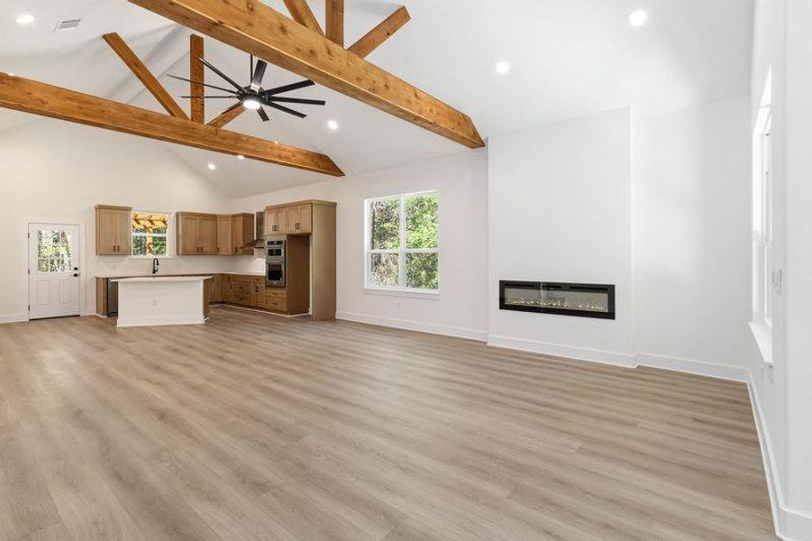 Living room with  Vaulted Ceiling and Wood Beams