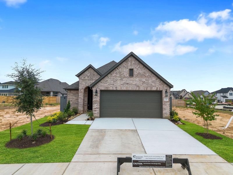Front exterior of a new home in Jubilee 40', Hockley, TX, highlighting curb appeal (Image 21). Front exterior of a new home in Jubilee 40', Hockley, TX, highlighting curb appeal (Image 21).