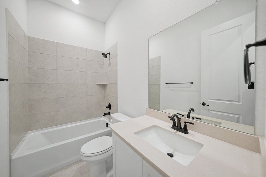 Furnished interior view inside a new home in Light Farms Brenham - 40' Lots, Celina (Image 13).