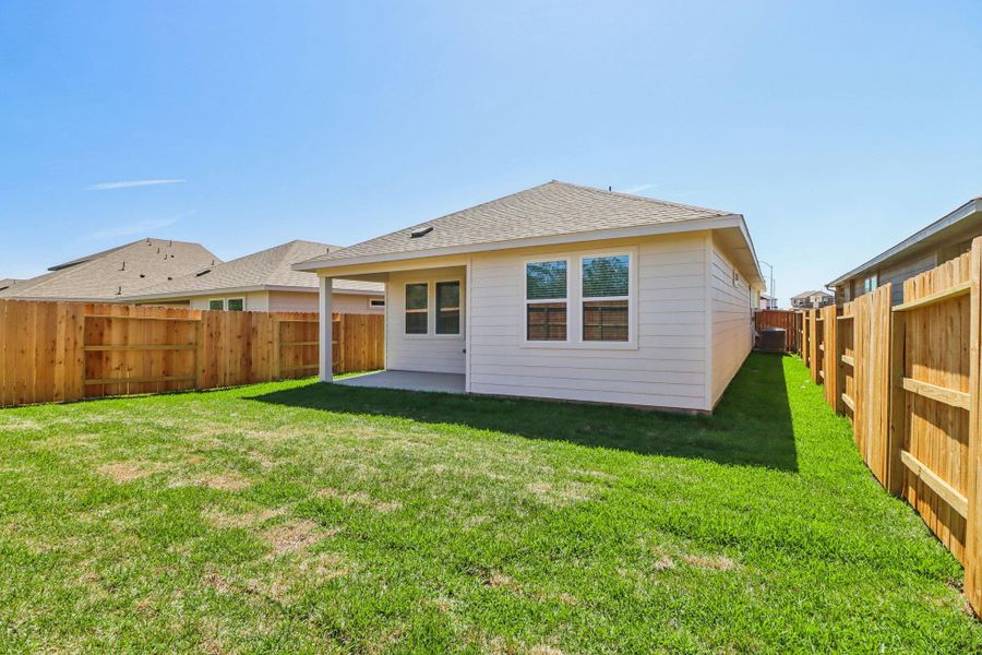 Exterior details and patio area of a home in Sanford Farms - Traditional Series, Conroe (Image 22).
