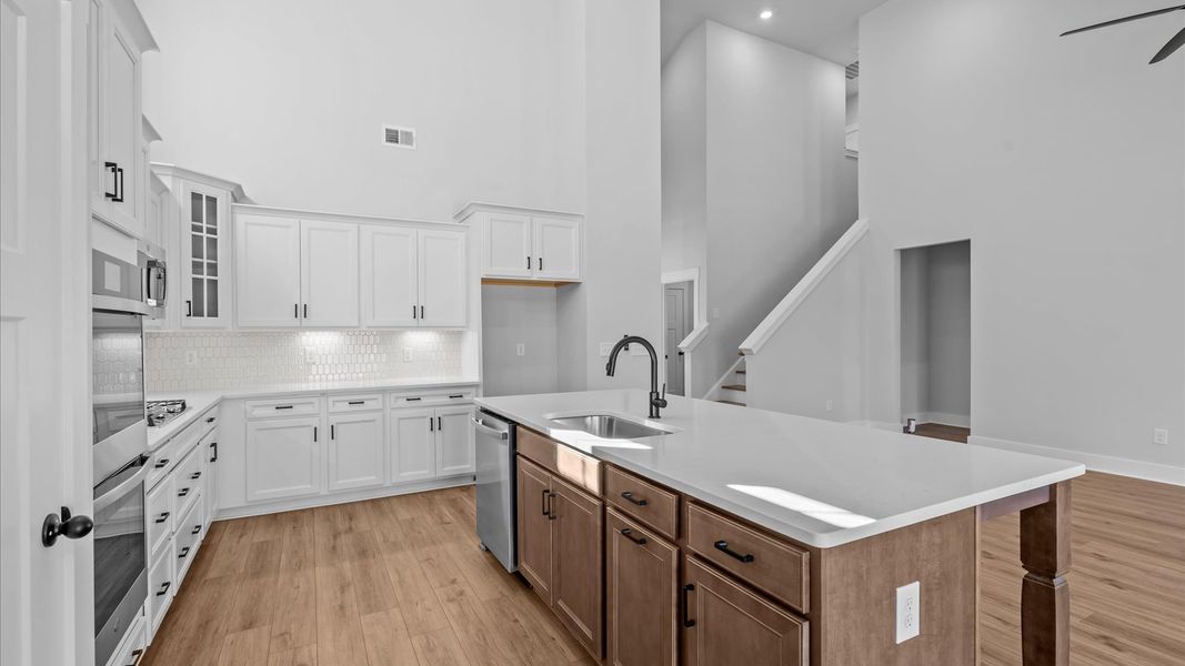 Tasteful design meets functional luxury in this kitchen with a 9-foot island