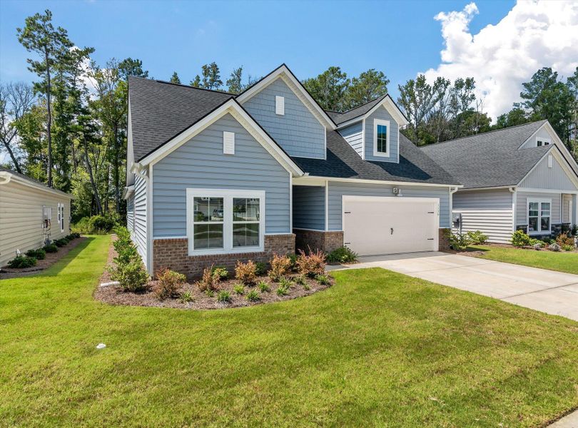 Front exterior of a new home in Horizons at Summers Corner | 55+: The Legends, Summerville, SC, highlighting curb appeal (Image 21). Front exterior of a new home in Horizons at Summers Corner | 55+: The Legends, Summerville, SC, highlighting curb appeal (Image 21).