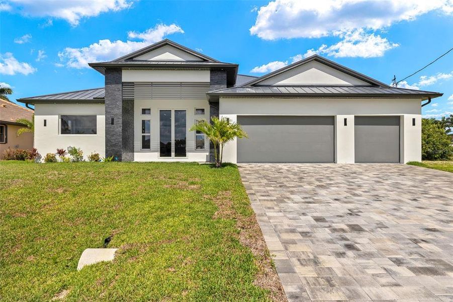 Front exterior of a new home in , Cape Coral, FL, highlighting curb appeal (Image 34). Front exterior of a new home in , Cape Coral, FL, highlighting curb appeal (Image 34).