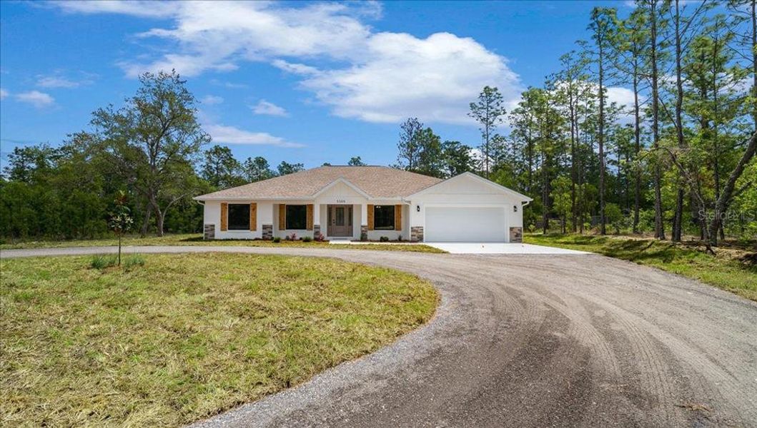 Front exterior of a new home in , Ocala, FL, highlighting curb appeal (Image 27).