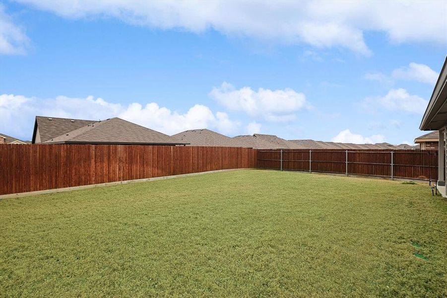 View of yard with a fenced backyard