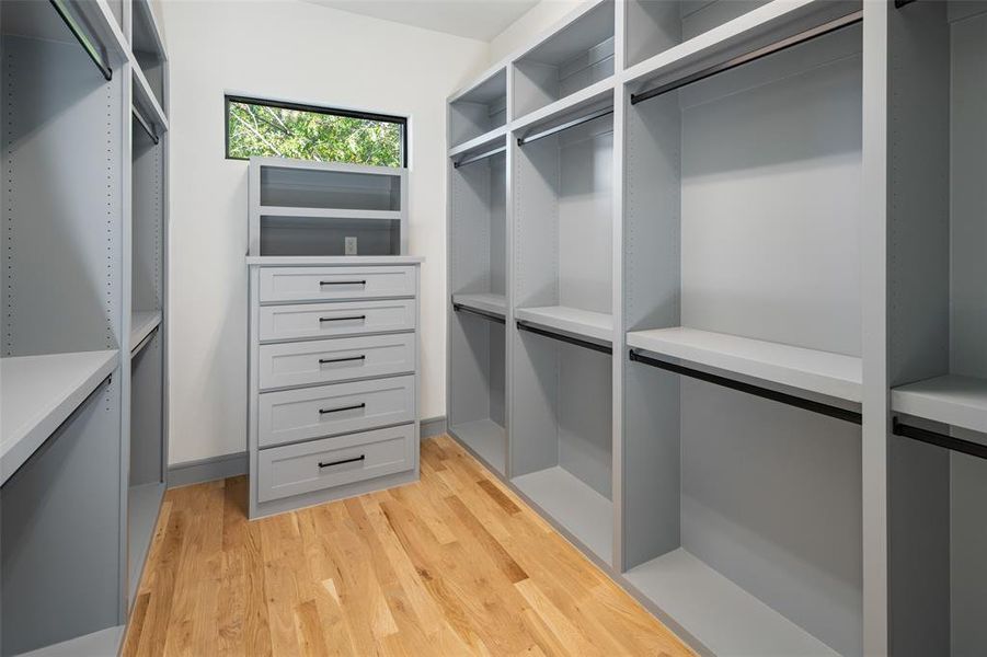 Walk in closet featuring light wood-type flooring