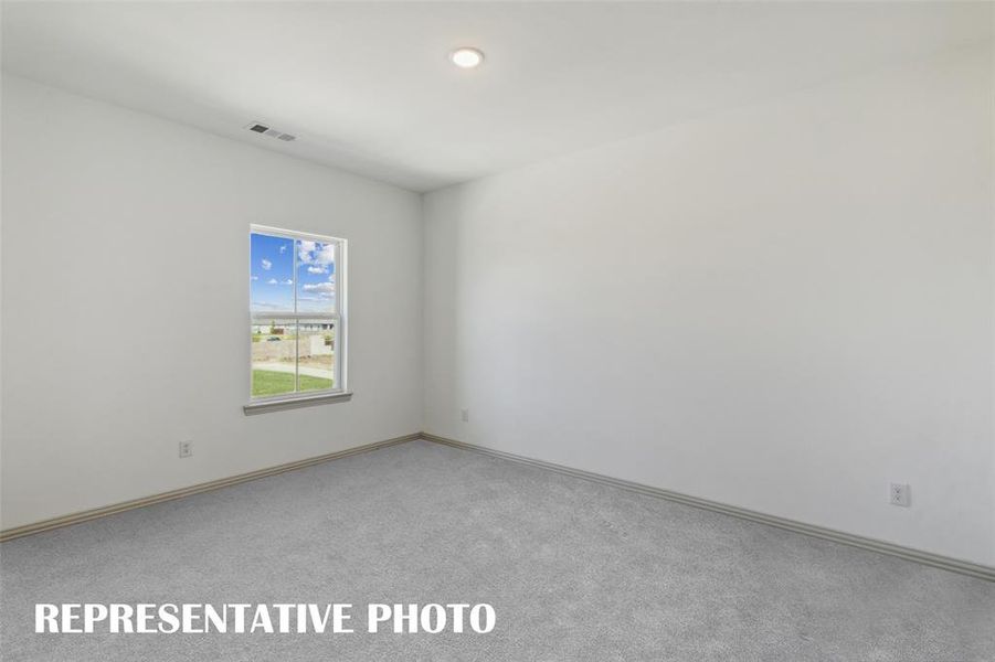 Your new home offers two spacious secondary bedrooms upstairs creating private spaces for your guests to relax.  REPRESENTATIVE PHOTO