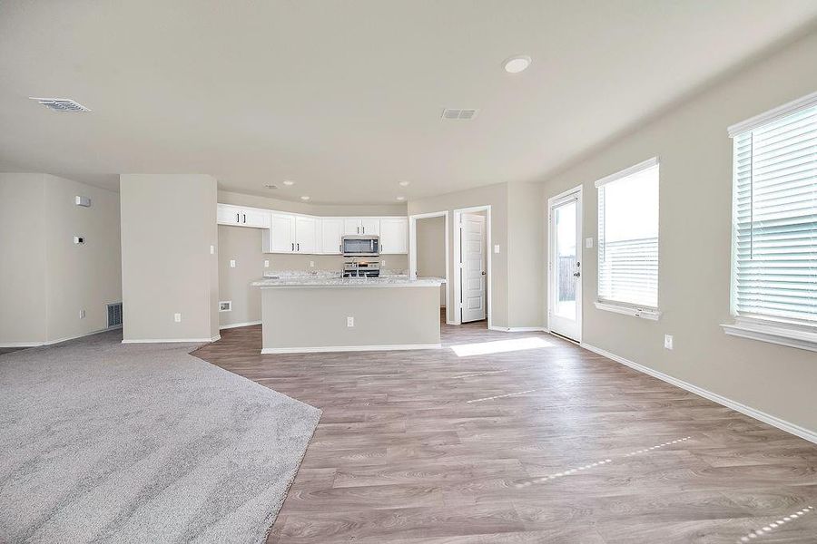 Unfurnished living room with light wood-type flooring