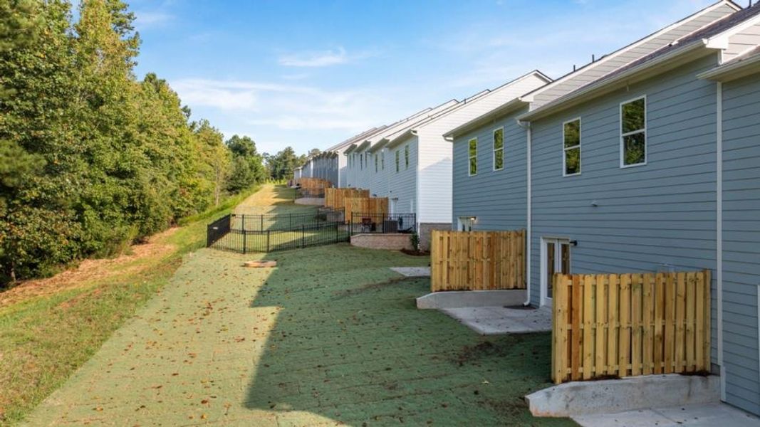 Exterior details and patio area of a home in Waypoint, Flowery Branch (Image 19).