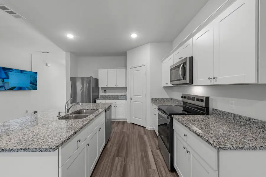 Island kitchen.  Refrigerator is included
