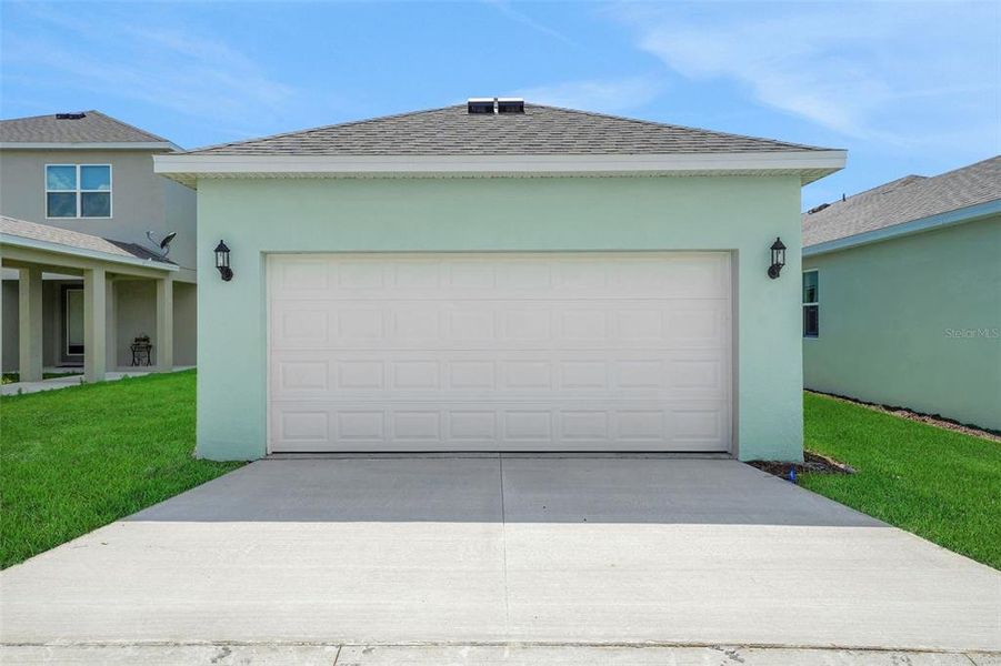 Front exterior of a new home in Crossroads at Kelly Park, Apopka, FL, highlighting curb appeal (Image 24).