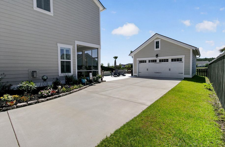 Front exterior of a new home in Carnes Crossroads, Summerville, SC, highlighting curb appeal (Image 27).