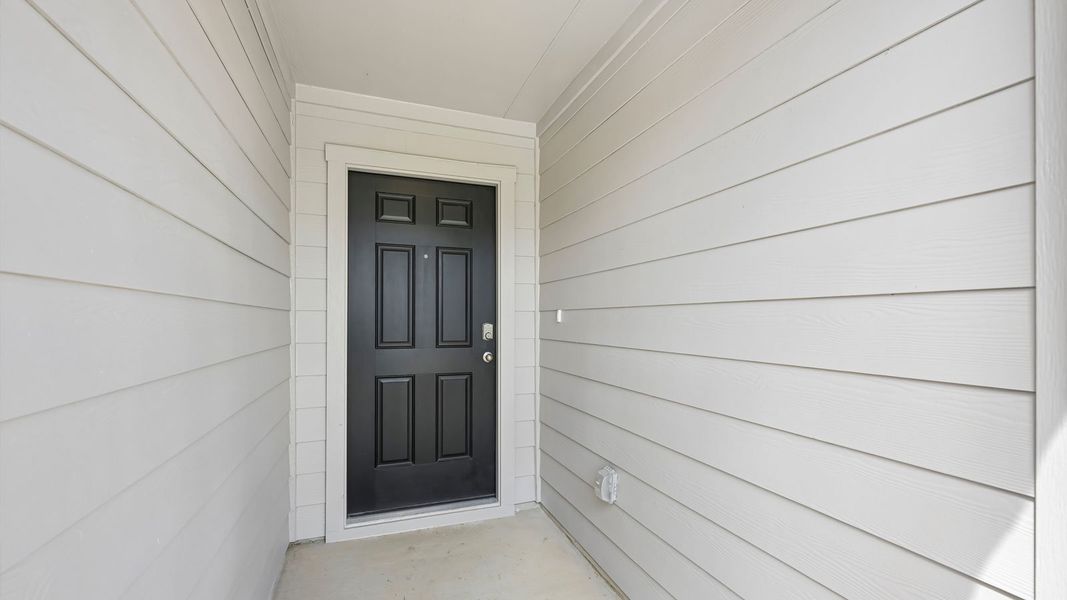 Exterior details and patio area of a home in Carillon, Manor (Image 3).
