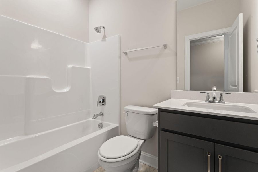Furnished interior view inside a new home in Tidewater at Lakes of Cane Bay, Summerville (Image 10).