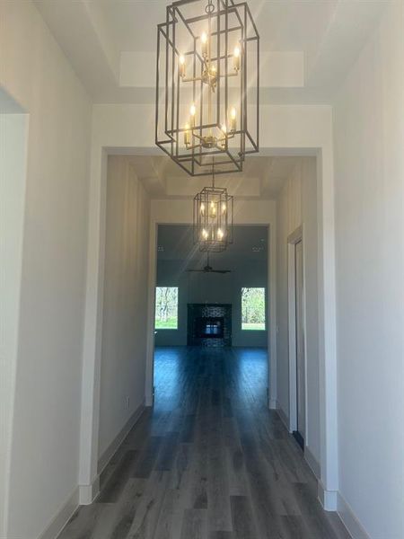 View as you enter the property, with tray ceilings and two large chandeliers.