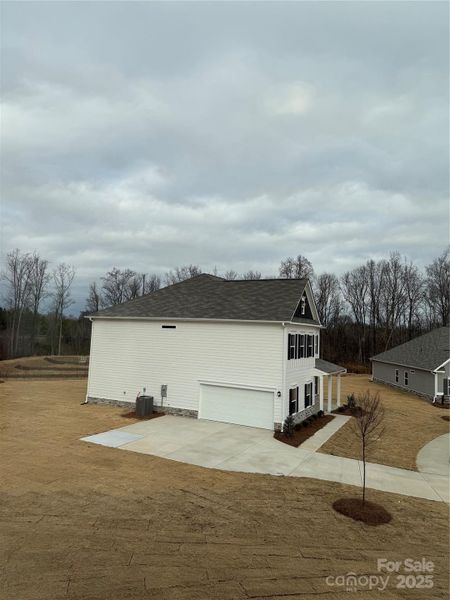 Front exterior of a new home in Cedar Meadows, Monroe, NC, highlighting curb appeal (Image 1). Front exterior of a new home in Cedar Meadows, Monroe, NC, highlighting curb appeal (Image 1).