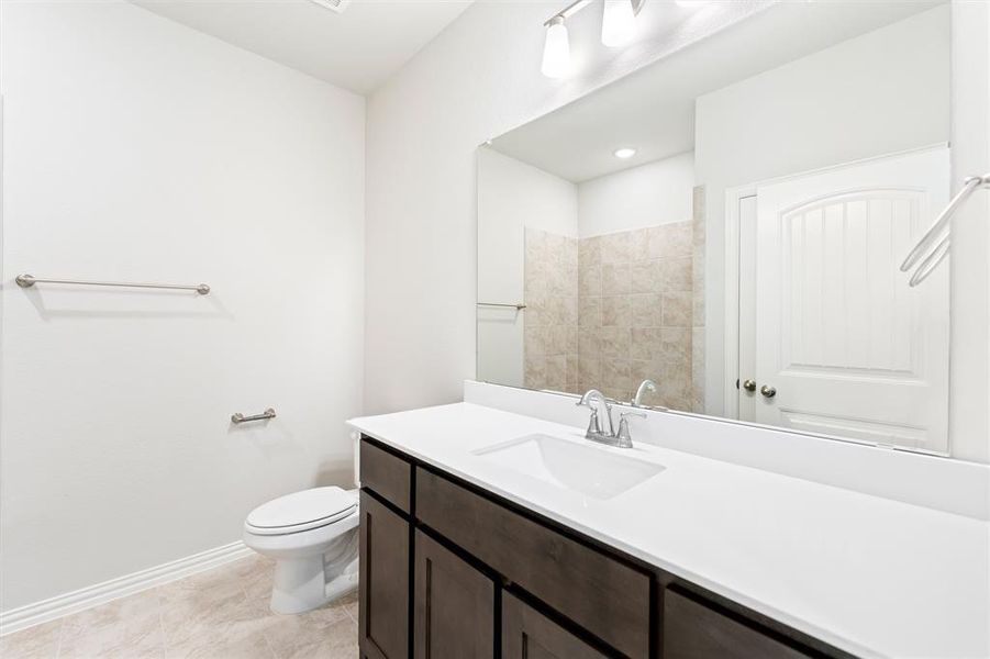 Bathroom with vanity and toilet