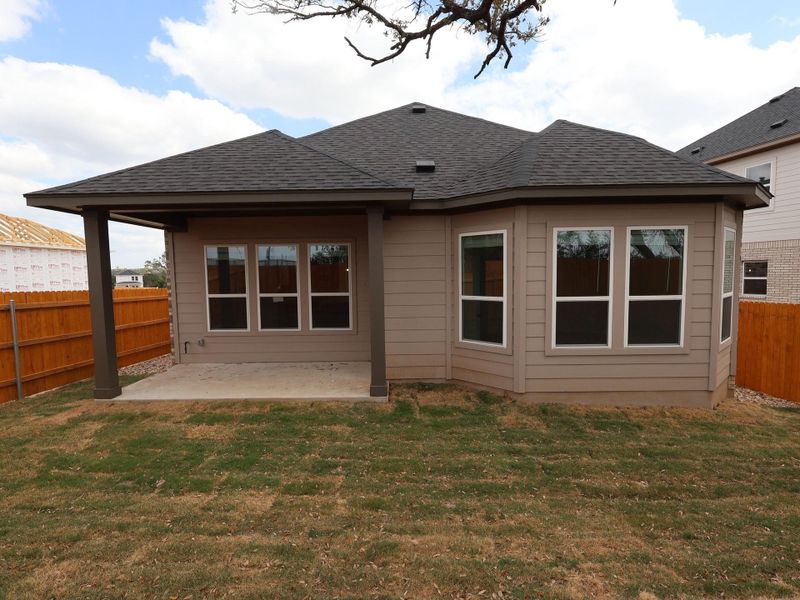 Exterior details and patio area of a home in Heritage, Dripping Springs (Image 3).
