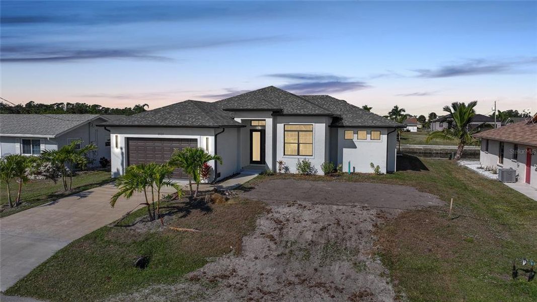 Front exterior of a new home in , Port Charlotte, FL, highlighting curb appeal (Image 19).