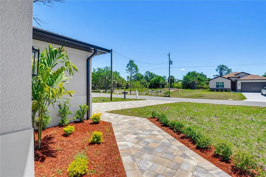 Exterior details and patio area of a home in , North Port (Image 28).