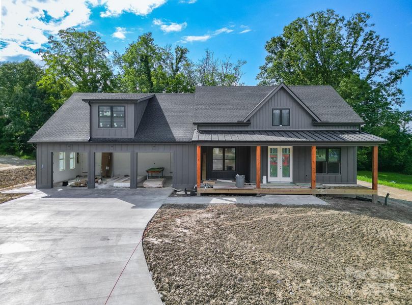 Front exterior of a new home in , Mills River, NC, highlighting curb appeal (Image 20).