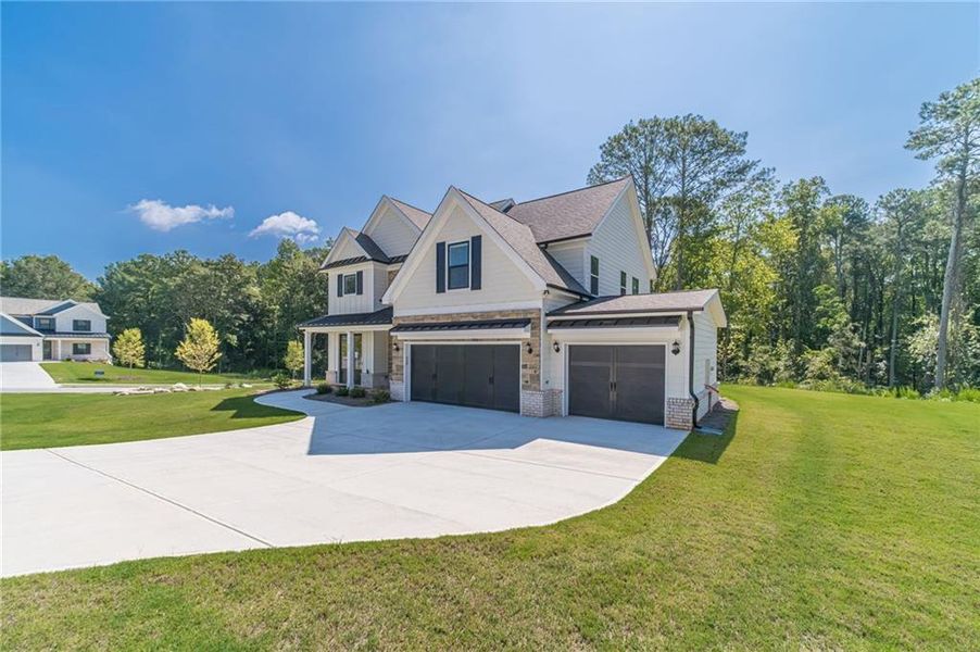 Front exterior of a new home in , Loganville, GA, highlighting curb appeal (Image 25).