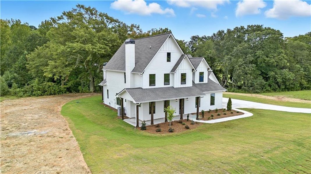 Front exterior of a new home in Old Town Estates, Dacula, GA, highlighting curb appeal (Image 31).