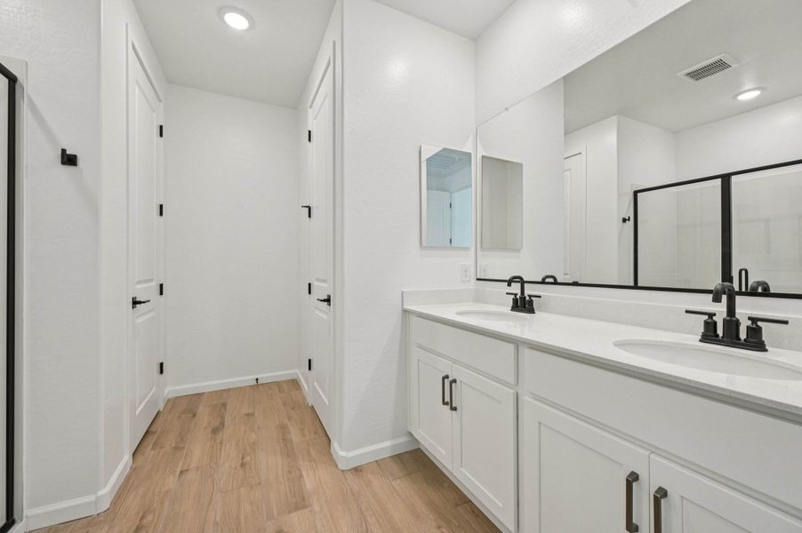 Primary bath. Finishes and options may vary by community.