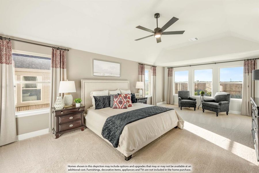 Spacious master bedroom with vaulted ceiling, ceiling fan, carpet flooring, and large windows Spacious master bedroom with vaulted ceiling, ceiling fan, carpet flooring, and large windows