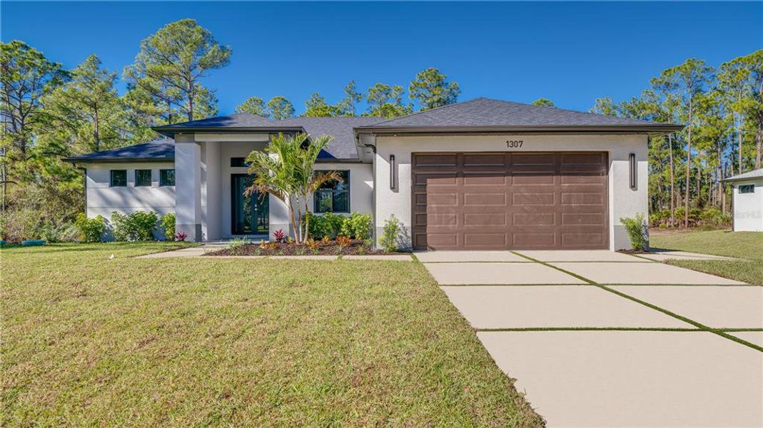 Front exterior of a new home in , Lehigh Acres, FL, highlighting curb appeal (Image 1). Front exterior of a new home in , Lehigh Acres, FL, highlighting curb appeal (Image 1).