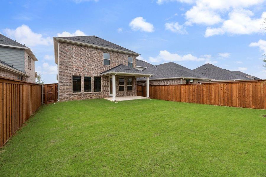 Exterior details and patio area of a home in Spiritas Ranch, Little Elm (Image 23).