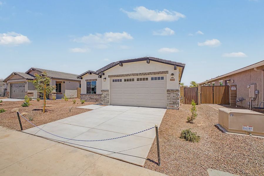 Front exterior of a new home in Avanti at Granite Vista, Waddell, AZ, highlighting curb appeal (Image 2). Front exterior of a new home in Avanti at Granite Vista, Waddell, AZ, highlighting curb appeal (Image 2).