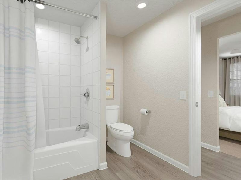 Bedrooms 2 and 3 share a Jack-and-Jill bath with dual vanities and a private tub and toilet room.