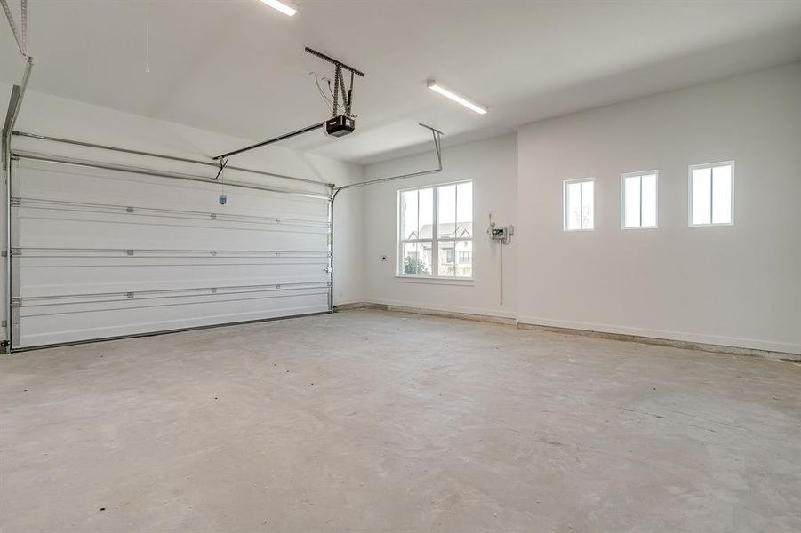 Garage featuring baseboards Garage featuring baseboards