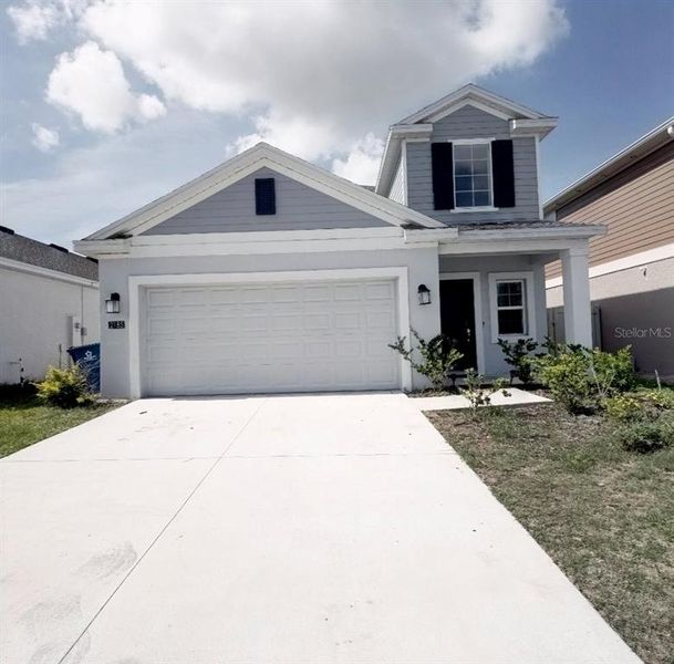 Front exterior of a new home in , Davenport, FL, highlighting curb appeal (Image 2). Front exterior of a new home in , Davenport, FL, highlighting curb appeal (Image 2).