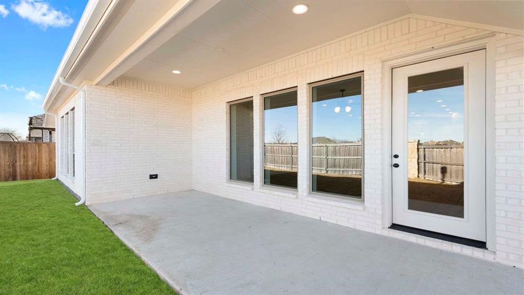 Exterior details and patio area of a home in Devonshire - Reserve 50', Forney (Image 2).