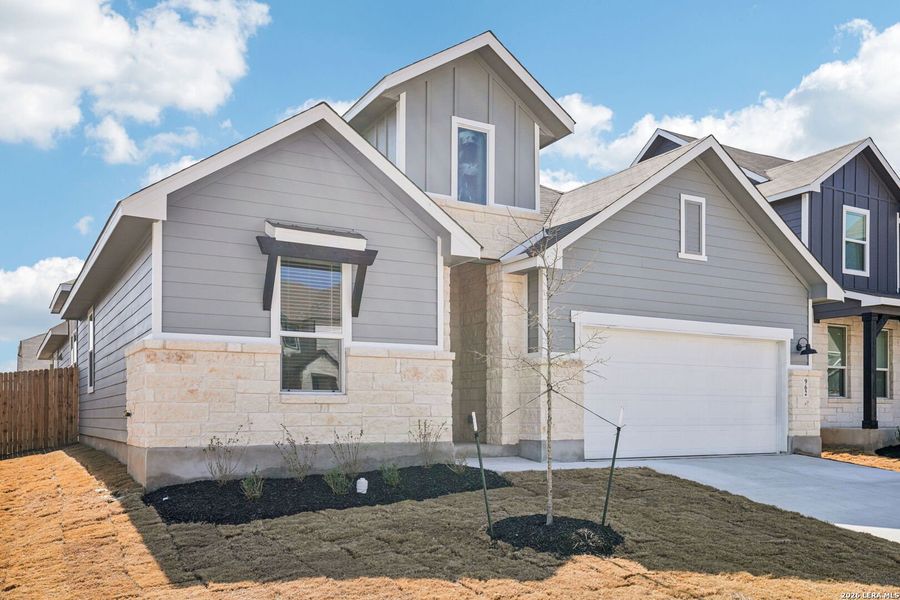 Front exterior of a new home in Estancia Ranch - Classic Series, San Antonio, TX, highlighting curb appeal (Image 21).