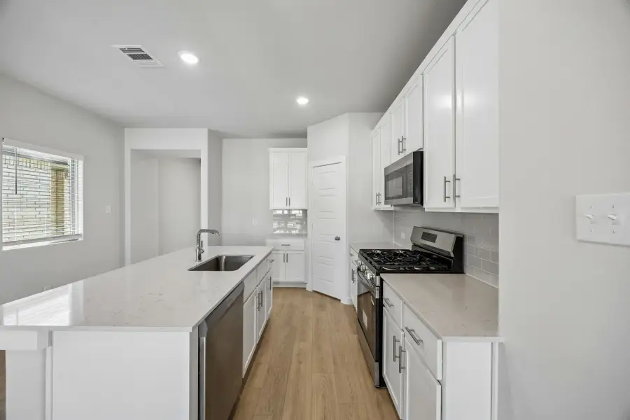 Kitchen in the Birch home plan by Trophy Signature Homes – REPRESENTATIVE PHOTO Kitchen in the Birch home plan by Trophy Signature Homes – REPRESENTATIVE PHOTO