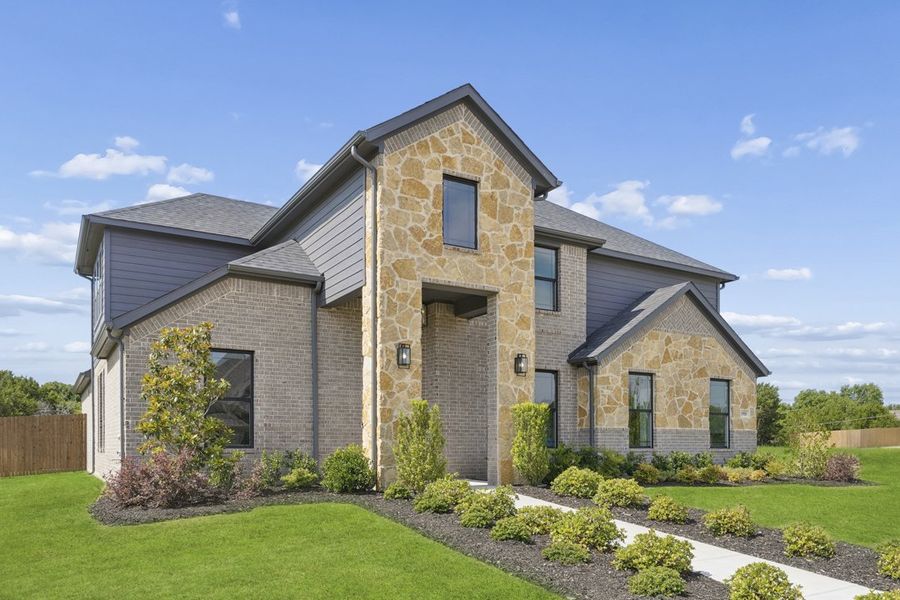 Front exterior of a new home in Ten Mile Creek, DeSoto, TX, highlighting curb appeal (Image 2). Front exterior of a new home in Ten Mile Creek, DeSoto, TX, highlighting curb appeal (Image 2).