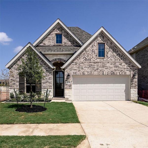 Front exterior of a new home in Juniper Springs, Lockhart, TX, highlighting curb appeal (Image 21).