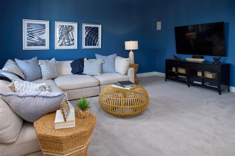 Living room featuring carpet and baseboards
