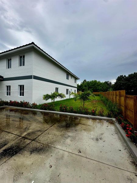 Front exterior of a new home in , Florida City, FL, highlighting curb appeal (Image 20). Front exterior of a new home in , Florida City, FL, highlighting curb appeal (Image 20).